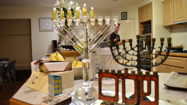  The Chernys consider lighting the candelabrum the most important part of Hanukkah as it symbolises ushering in "light."