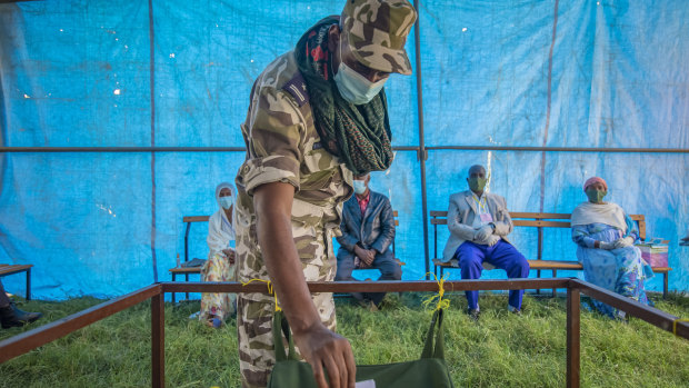 A member of the Tigray Special Forces casts his vote in a local election in the regional capital Mekelle in September. The Ethiopian government declared the election illegal.