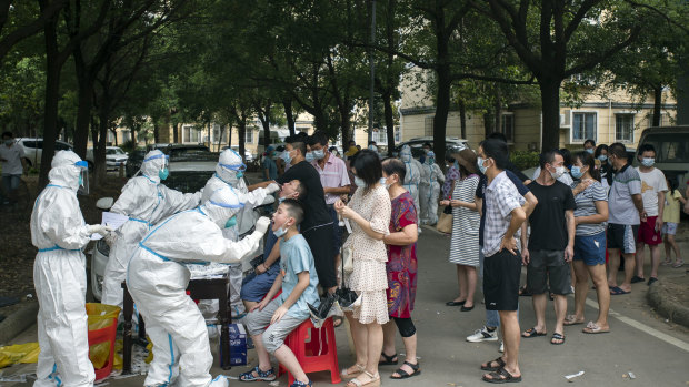 Residents line up to be tested for COVID-19 in Wuhan.