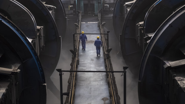 Workers of Caofeidian Port in Hebei Province. 