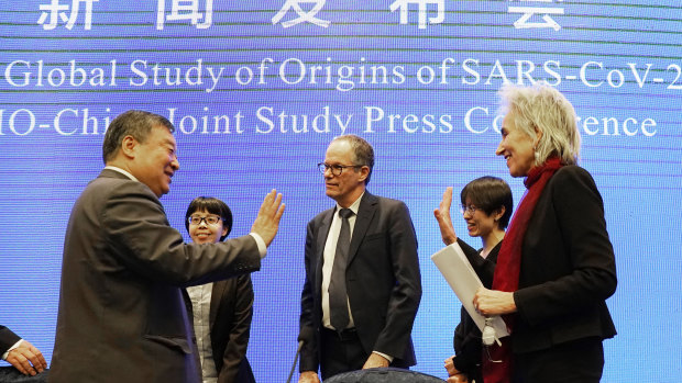 The World Health Organisation team say farewell to their Chinese counterparts after the WHO-China Joint Study Press Conference on Tuesday. 