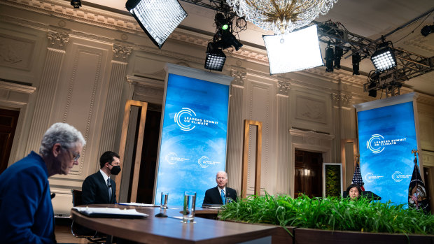 US President Joe Biden, centre, speaks during the virtual Leaders Summit on Climate in the East Room of the White House in Washington, DC. 