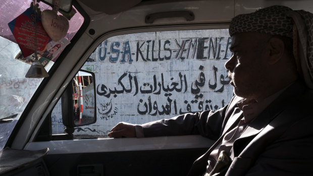 Anti-American graffiti on the street in Sanaa after the war started in 2015.