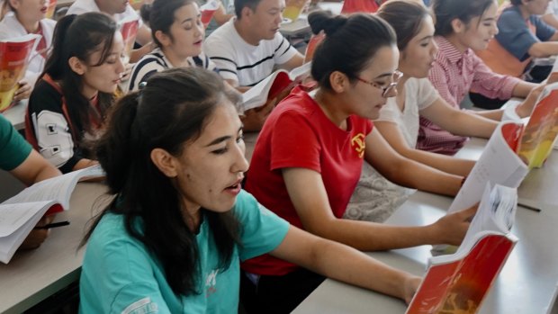 Young Uighurs study Chinese law at the Atushi Vocational Training Centre, Xinjiang. 