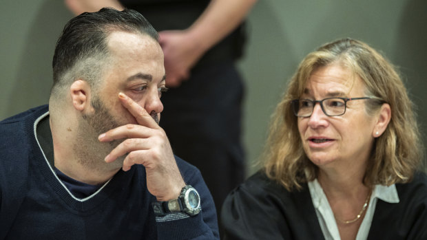 Former nurse Niels Hoegel, left, accused of multiple murder and attempted murder of patients, talks to his lawyer Ulrike Baumann.