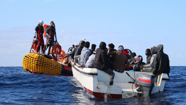 SOS Mediterranee team members from the humanitarian ship Ocean Viking approach a boat in distress with 30 people on board in the waters off Libya on December 16.