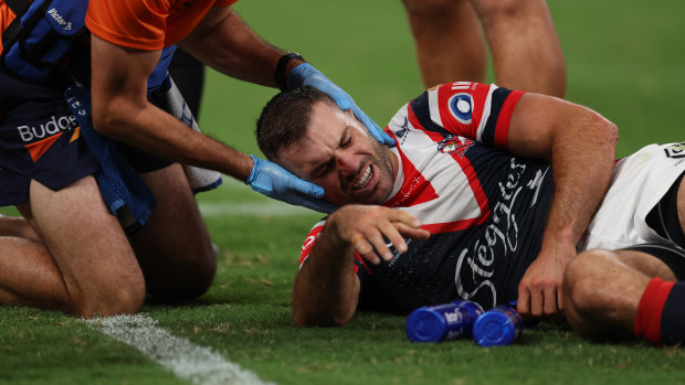 James Tedesco is treated for concussion after Bailey Simonsson’s high shot.