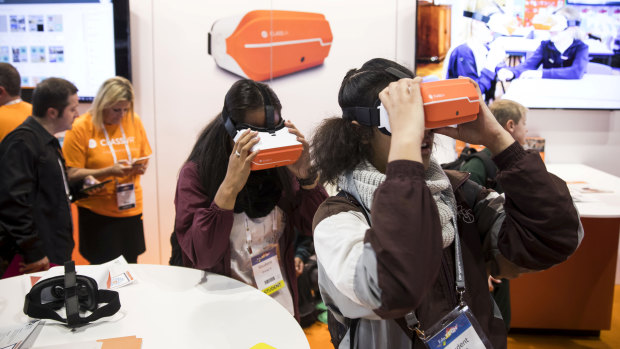 Making learning fun: Young students get to grips with virtual reality teaching aids at the EduTECH education trade fair.