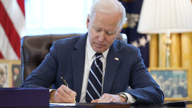 US President Joe Biden as he signed the American Rescue Plan, a coronavirus relief package, in the Oval Office of the White House on Thursday.