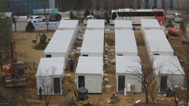 Containers to be used as a ward to treat people infected with the coronavirus are set up on the grounds of the Seoul Medical Center.
