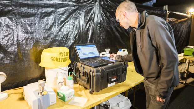 Senior pill-testing chemist Mal Mcleod deomstrates how a pill might be tested with the equipment they have at Groovin' the Moo in April.