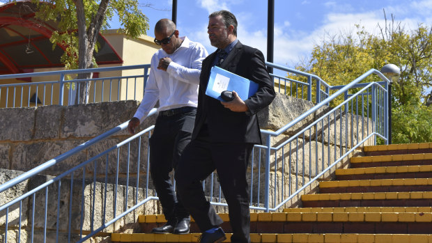 Mark Musa Bhatti (left) leaving court with his lawyer on Wednesday 