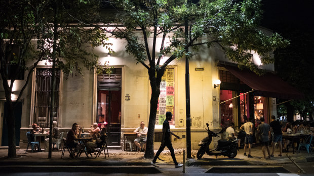 Customers sit outside of a restaurant at night in Buenos Aires, Argentina, on Wednesday, Jan 30, 2019. Argentina's capital typically witnesses a mass exodus when South American summer starts in late December. But with the economy in recession, a currency that lost half of its value since May, and salaries that can't keep up with inflation, many have scrapped travel plans. Photographer: Erica Canepa/Bloomberg