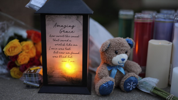 Flowers and candles placed outside the Abundant Life Christian School in Madison, Wisconsin, following the shooting.
