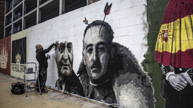Graffiti artist Roc Blackblock creates work in support of imprisoned rap artist Pablo Hasel at the Tres Xemeneies park in Barcelona, Spain. 
