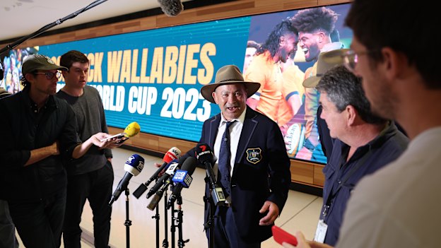 Eddie Jones attacks media, including Decent (right), at Sydney Airport.