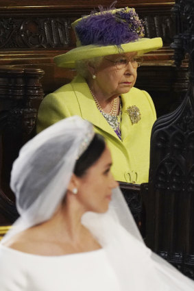 Queen Elizabeth looks on as she acquires a new grand-daughter in law.