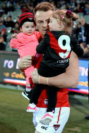 Brendon Goddard shares his final game with the Bombers with his children.