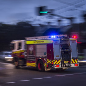 File photo. Firefighters remain at the scene in Girrawheen.