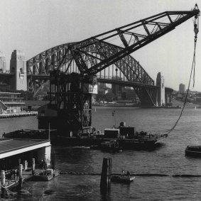 Titan moves into position to help raise the ferry Karrabee from Circular Quay on January 24, 1984.