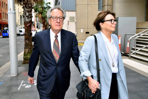 Geoffrey Rush, with his wife Jane Menelaus,  at the Federal Court in Sydney on Monday.