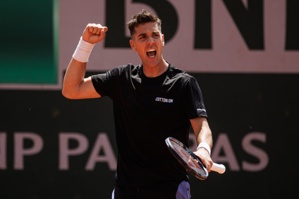 Thanasi Kokkinakis celebrates his first-round victory over Daniel Evans.