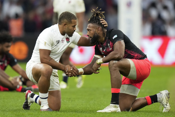 England’s Ollie Lawrence consoles Fiji’s Waisea Nayacalevu.