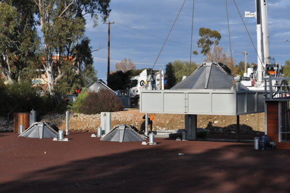 One of the four fish screens is lowered into a canal at Cohuna in northern Victoria.