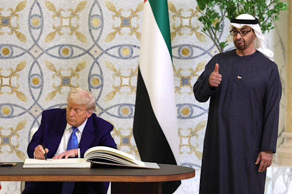 May 2025: US President Donald Trump signs a guestbook as Sheikh Mansour bin Zayed al-Nahyan’s brother, UAE President Mohamed bin Zayed, looks on.
