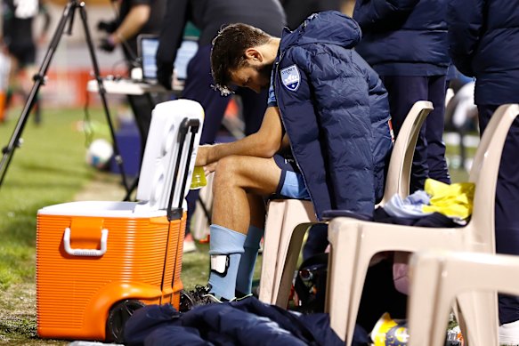 A dejected Milos Ninkovic on the bench after Sydney's loss to Western United.