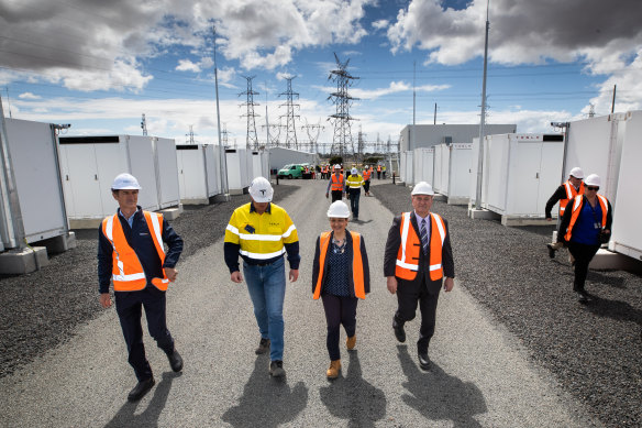Energy Minister Lily D’Ambrosio walking between Megapacks, as she flicked the switch on Victoria’s Big Battery on 8 December.