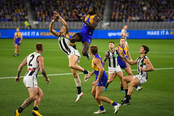 Nic Naitanui flies for a mark against Collingwood.