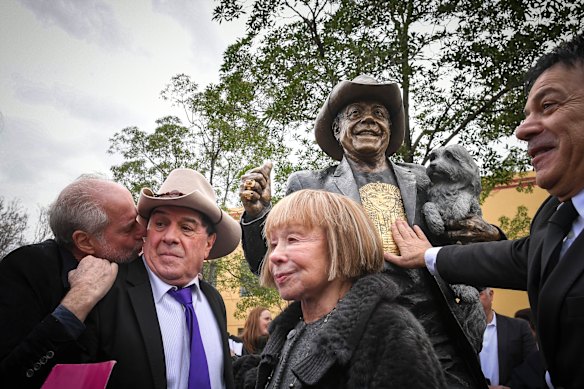 Michael Gudinski, Molly Meldrum, Jeanne Pratt and Ralph Carr share a moment during the launch of Meldrum’s statue in Richmond in 2018.