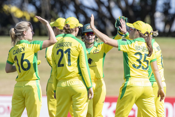 Australia celebrate bowling New Zealand all out for 212 runs. 