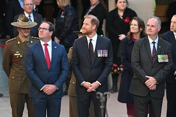 Matt Keogh, Minister for Veterans’ Affairs (left) and Harry attend a Last Post ceremony.