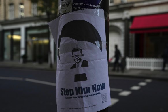 A placard featuring Chinese President Xi Jinping, is displayed near the Chinese embassy in London.