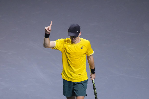 De Minaur celebrates a point.