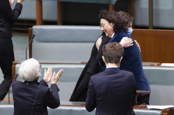 Member for Wentworth Allegra Spender congratulates Member for Kooyong Monique Ryan after she delivered her first speech in the House of Representatives on Thursday.