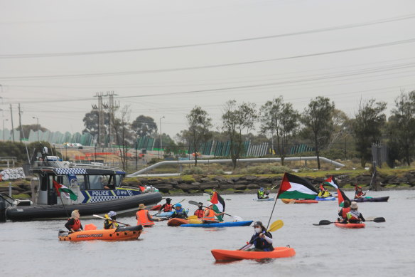 Protesters in the Port of Melbourne attempt to block ships owned by an Israeli shipping company.