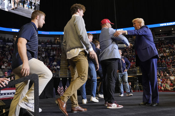 Donald Trump welcomed members of the Penn State wrestling team to the stage during his rally in State College, Pennsylvania.