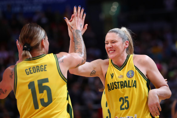 Lauren Jackson (right) and Cayla George celebrate the Opals’ key win over Serbia.
