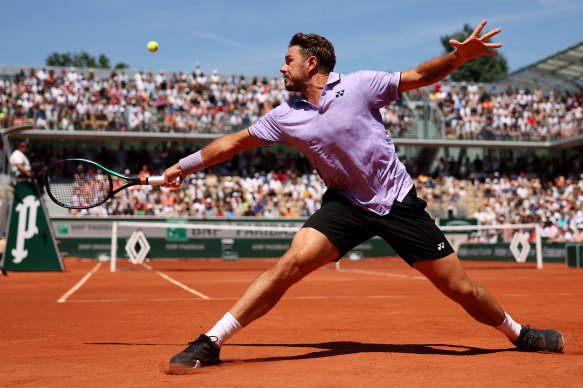 Stan Wawrinka at full stretch against Thanasi Kokkinakis.