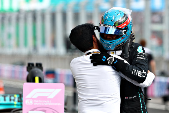 George Russell celebrates his first pole position with Mohammed ben Sulayem, FIA president.