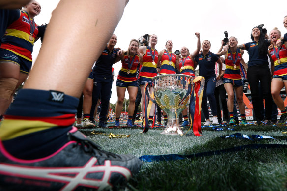 For the good of the game: Adelaide celebrate their 2019 AFLW premiership. 