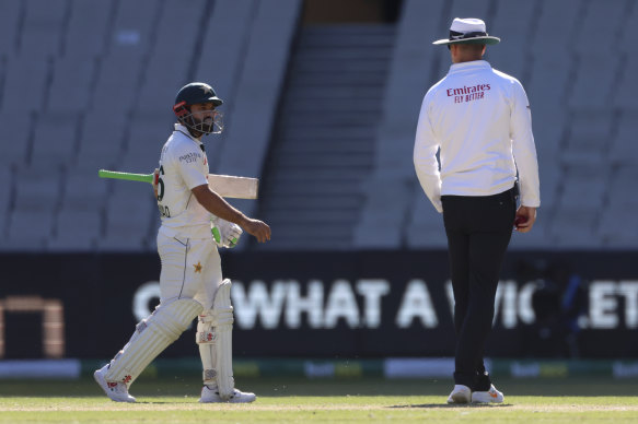 Pakistan’s Mohammad Rizwan leaves the ground after being given out.