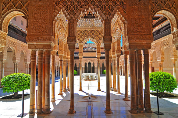 The Court of the Lions ia surrounded by arcades in a series of Islamic horseshoe arches.