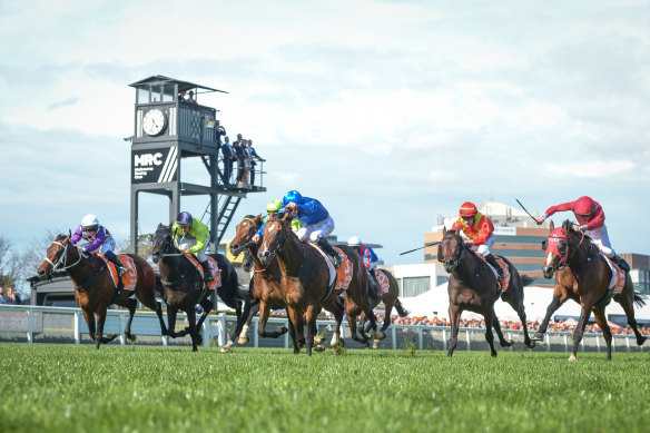 Golden Mile, ridden by jockey James McDonald, wins the Caulfield Guineas. 