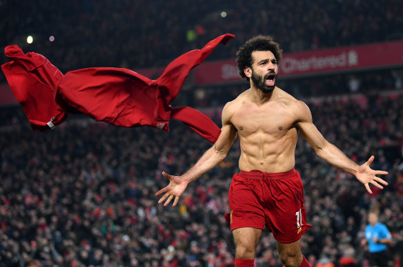 Mo Salah celebrates his stoppage-time goal for the Reds.