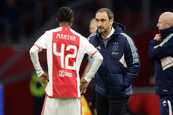 Michael Valkanis talks to Ar’jany Martha during Ajax’s game against Zwolle.