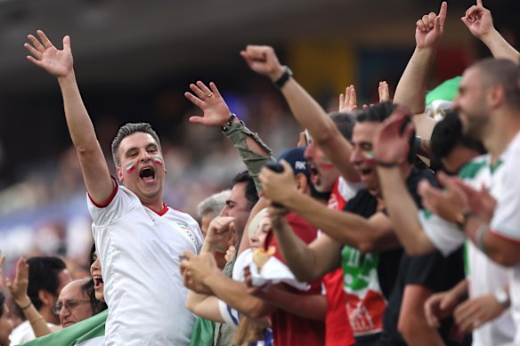 Iran fans celebrate the equaliser. 